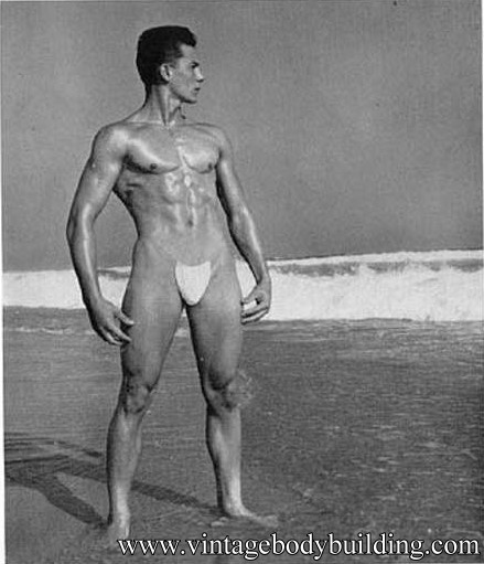 vintage muscle man posing outdoors