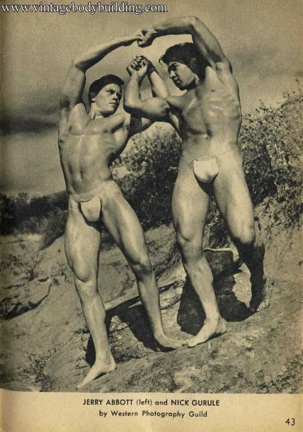 two bodybuuilders posing outdoors