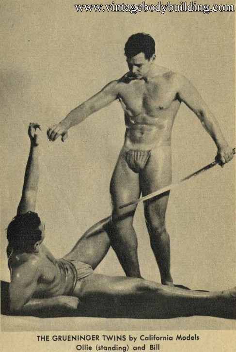 two vintage muscle men posing